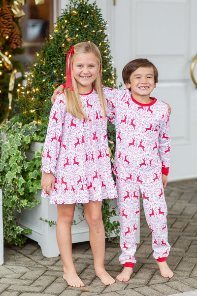 Siblings Matching in Rudolph Print Outfits on Christmas