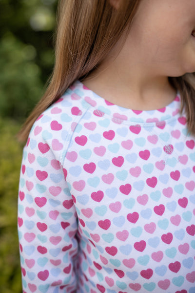 Close up of Grace and James Kids heart crewneck and leggings set for valentines