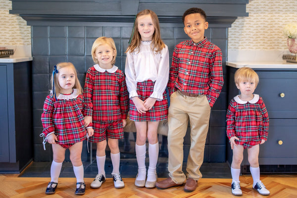 Children Wearing Coordinating Red Plaid Outfits in Different Styles