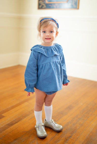 Little Girl Wearing Molly Diaper Set with a Matching Blue Headband