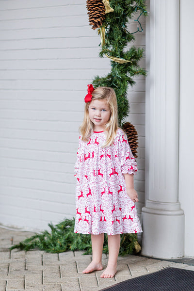 Girl Wearing the Rudolph Dress with Matching Red Bow