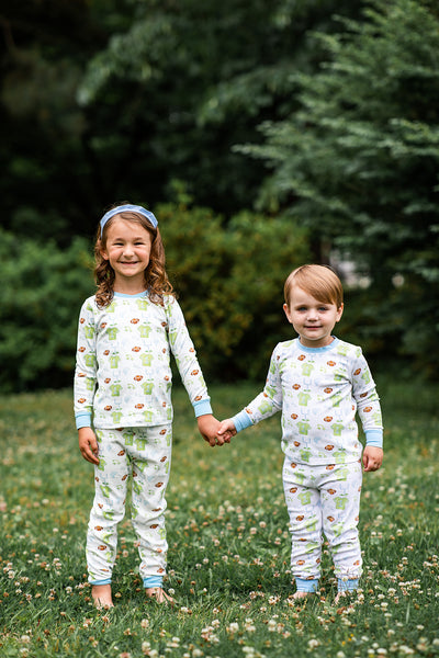 Siblings Wearing Custom Football Print in Matching Onesie and Set