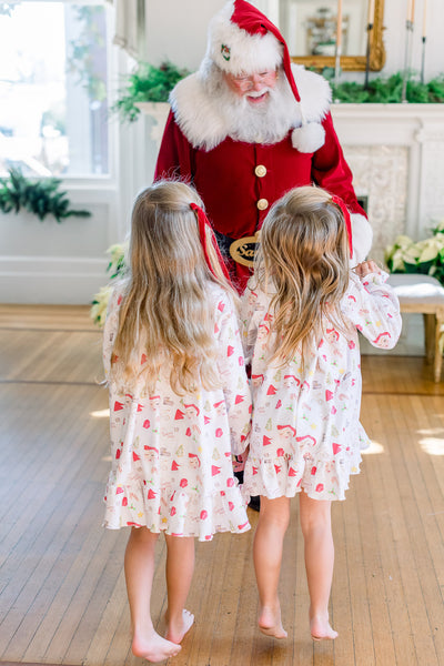 Sisters Meeting Santa in Matching Letters to Santa Dresses